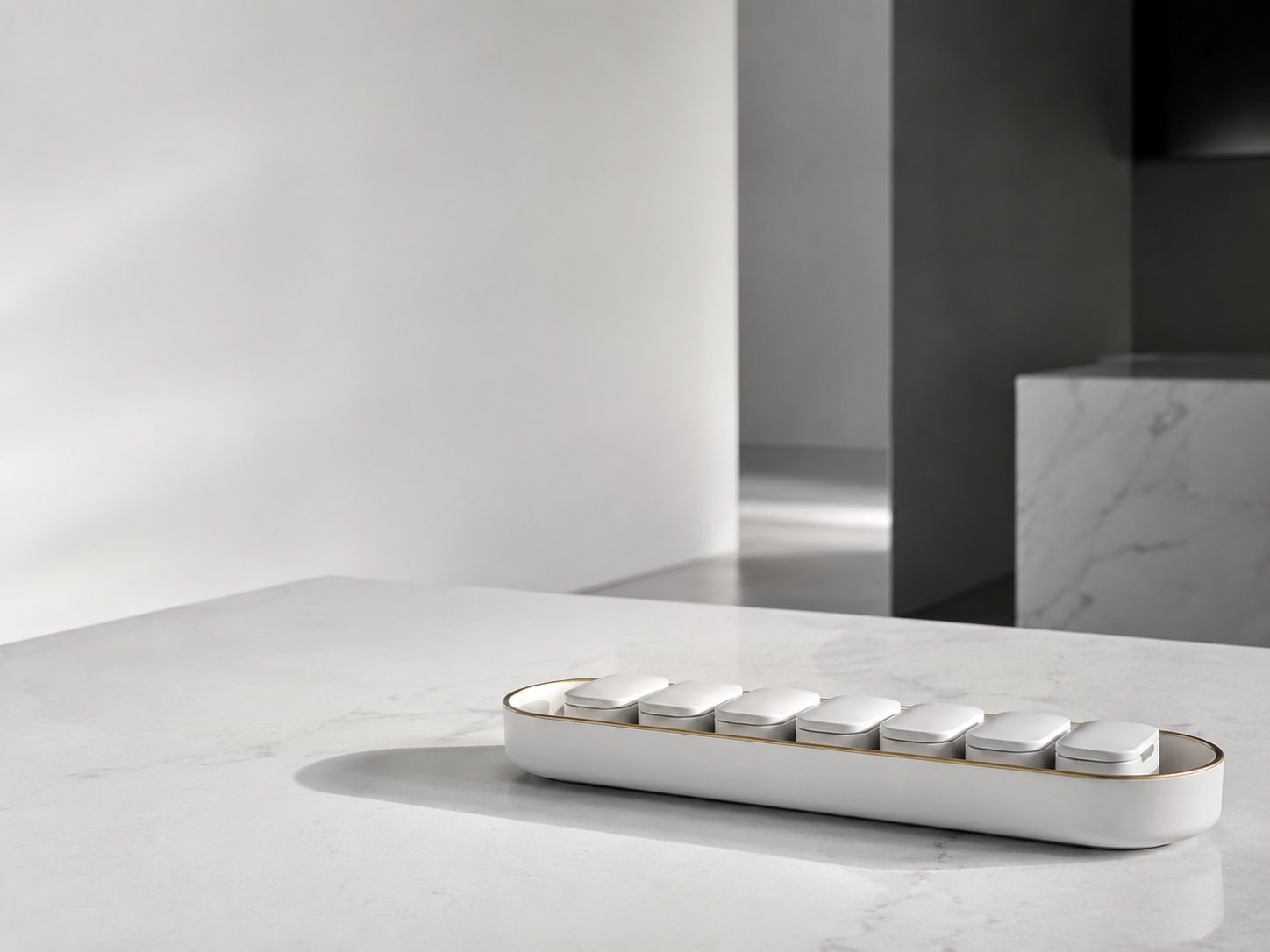 A tray of Libra daily pods on a stone counter in a calm, light-filled home